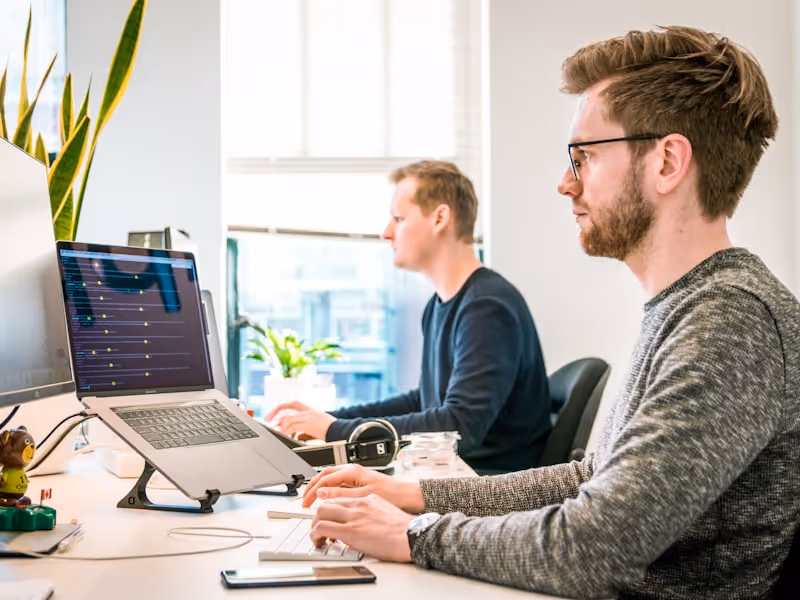 Modern web development workspace with multiple screens